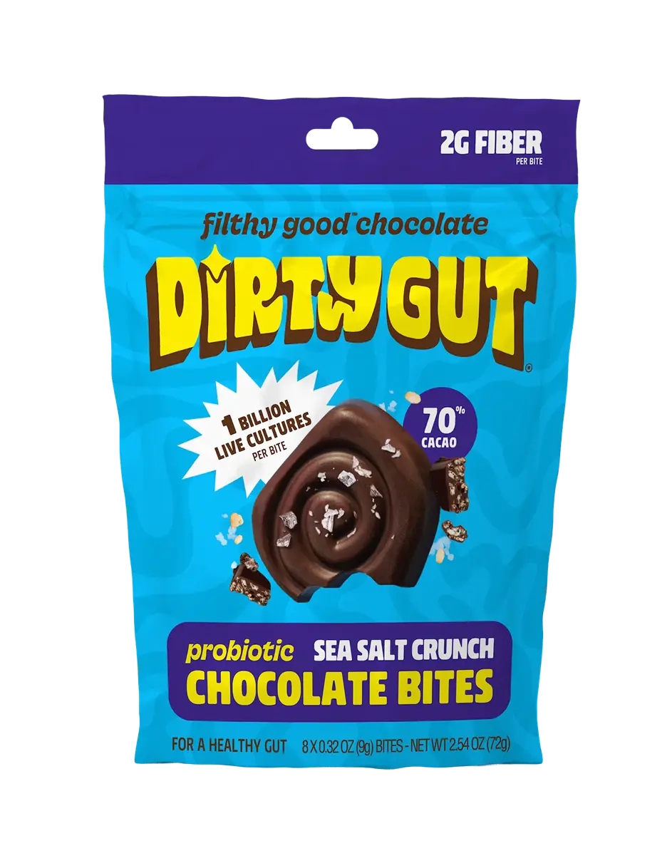 A blue and purple bag of Dirty Gut Probiotic Sea Salt Crunch Chocolate Bites on a green background.