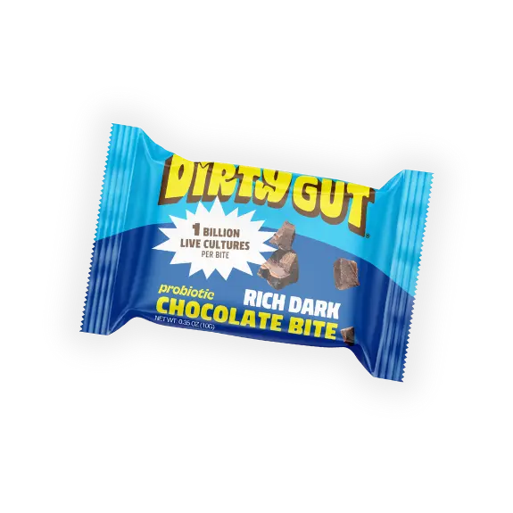 A Dirty Gut Probiotic Rich Dark Chocolate Bite in its blue wrapper.