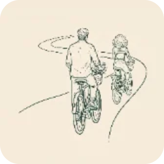 Two cyclists riding along a winding road