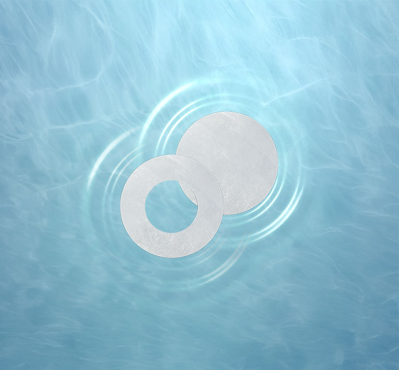 Two metallic discs on a blue water background with ripples.
