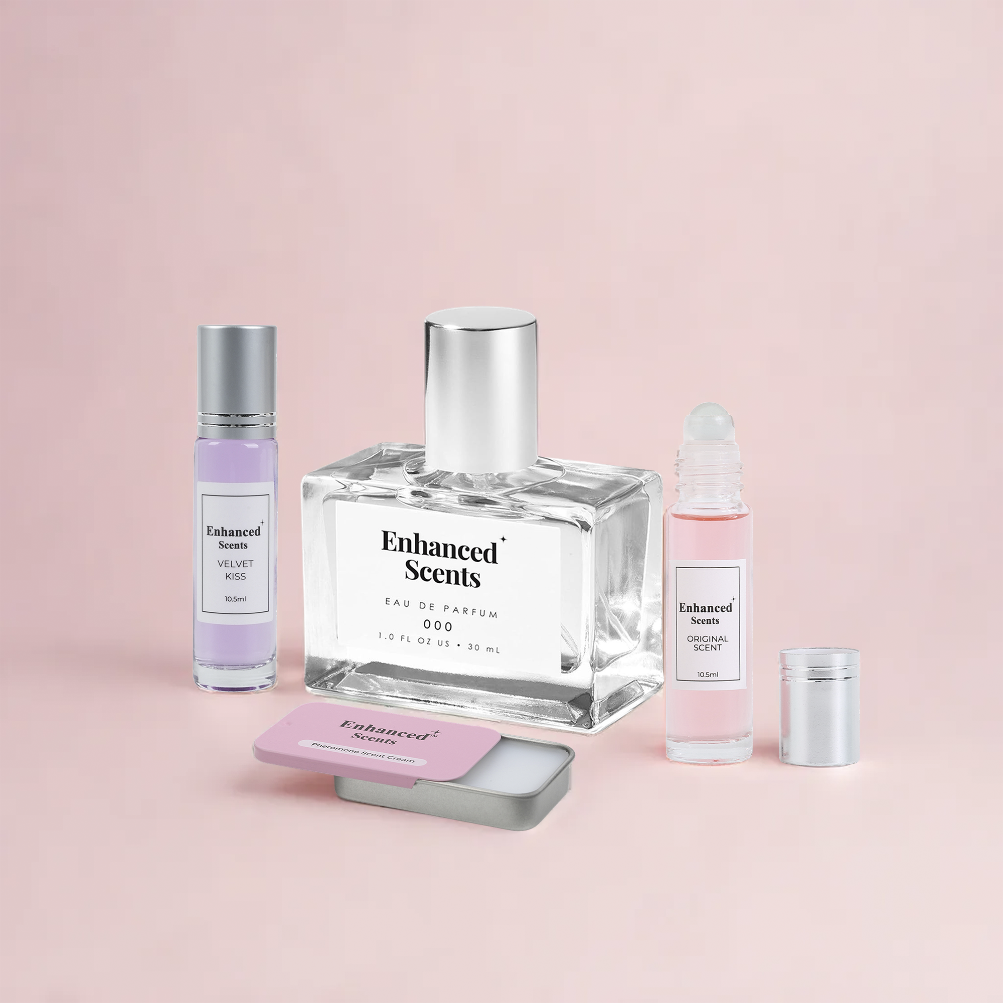 Perfume bottles and a tin on a pink background.