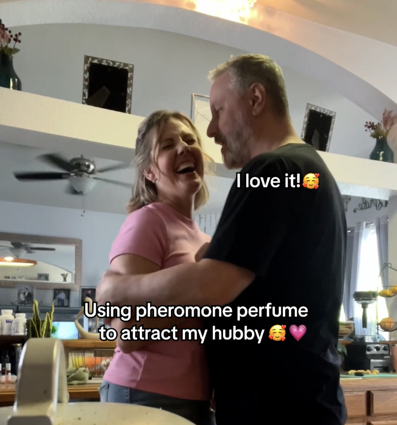 A couple embracing and smiling in a living room with text overlay.
