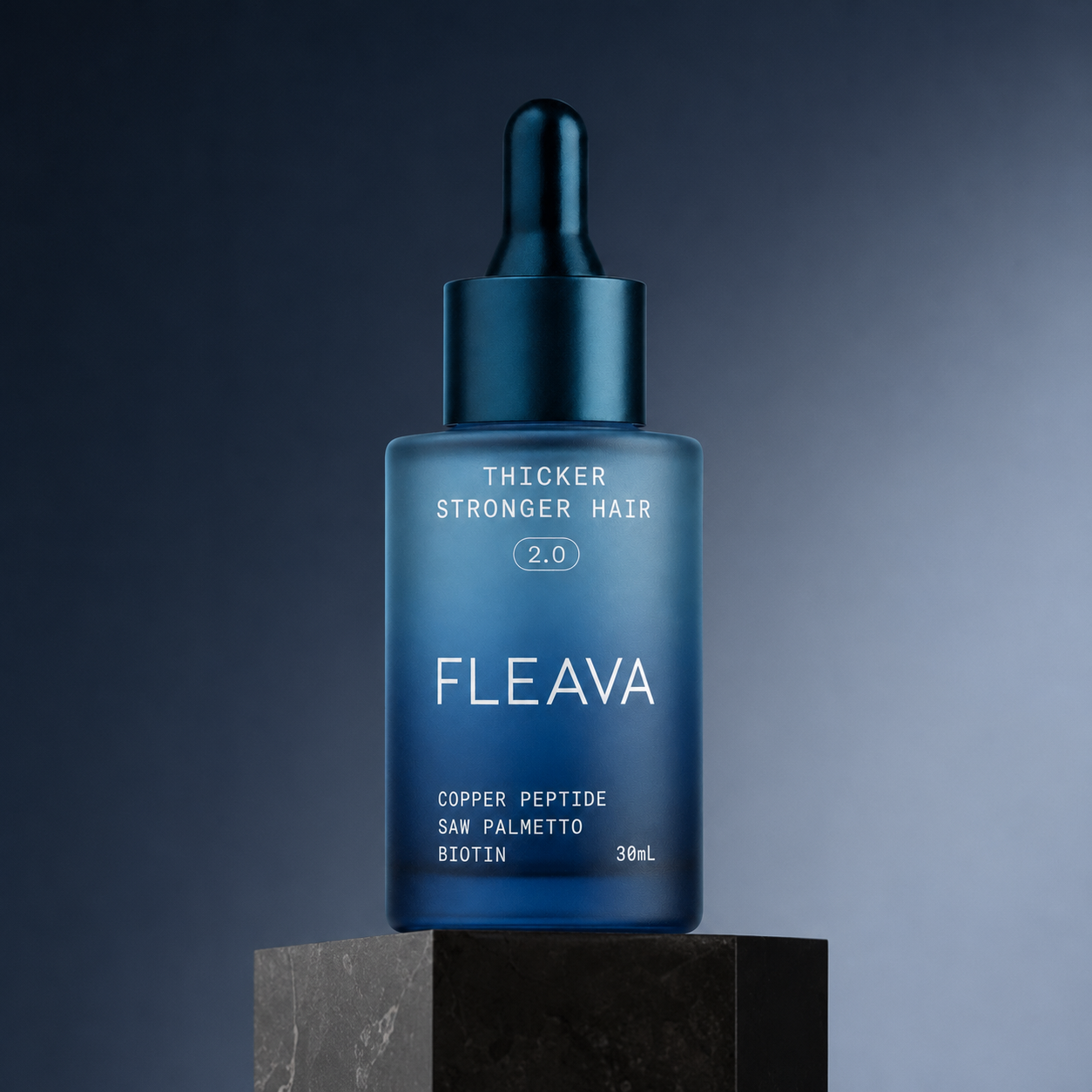 A bottle of Fleava Strong Hair Growth 2.0 serum resting on a dark stone pedestal.