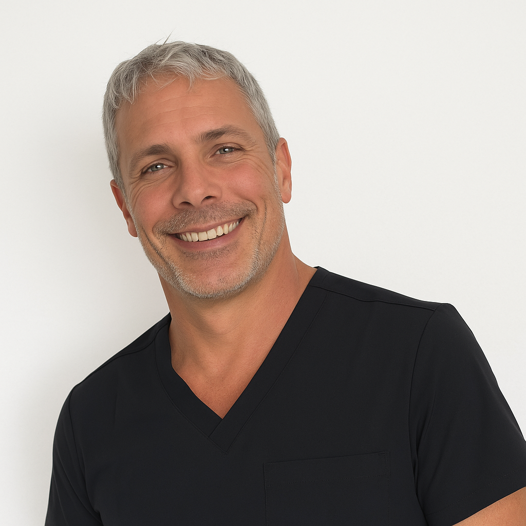 Smiling man with gray hair wearing a black V-neck shirt.