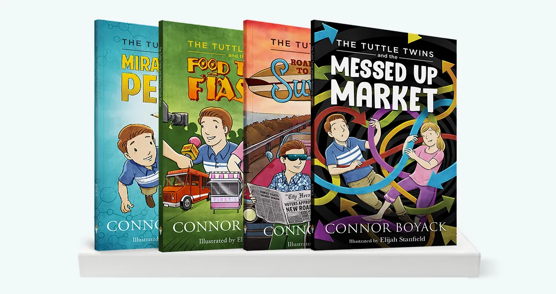Four illustrated books from The Tuttle Twins series by Connor Boyack standing on a white shelf.