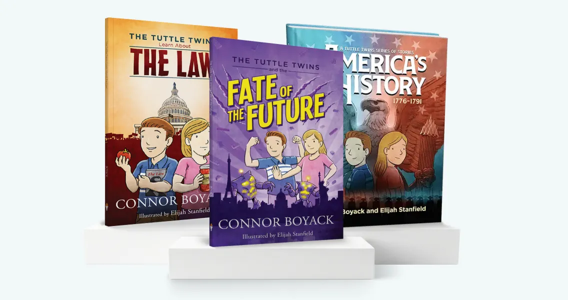 Three illustrated children's books from 'The Tuttle Twins' series displayed on white blocks against a light background.