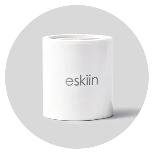 A white cylindrical container with the logo 'eskiin' in grey lowercase letters on a light grey background.
