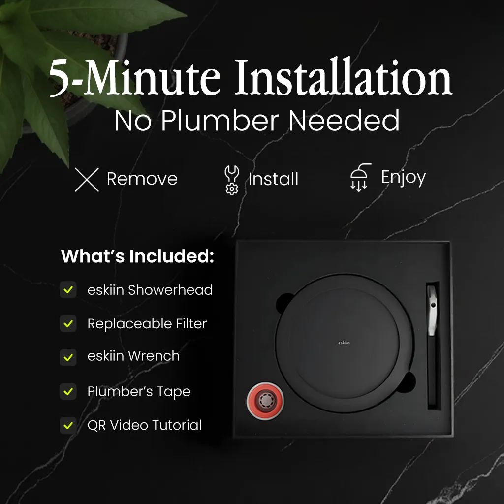 Showerhead installation kit with instructions, tools, and plant on black marble background.