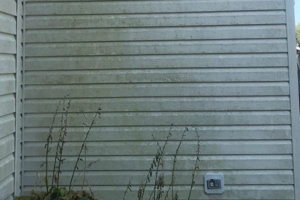 Dirty house exterior cleaned in Marietta GA – remove mildew and algae from siding, soffits, and fascia with gentle low-pressure washing