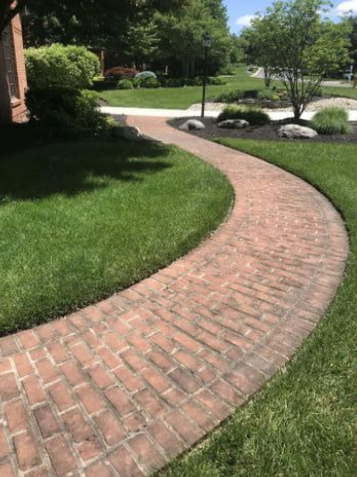 Before and after concrete driveway pressure washing in North Marietta, GA by S & S Clean Co – same-day service and veteran discounts available pressure washing company driveway sale kennesaw marieta cartersville.