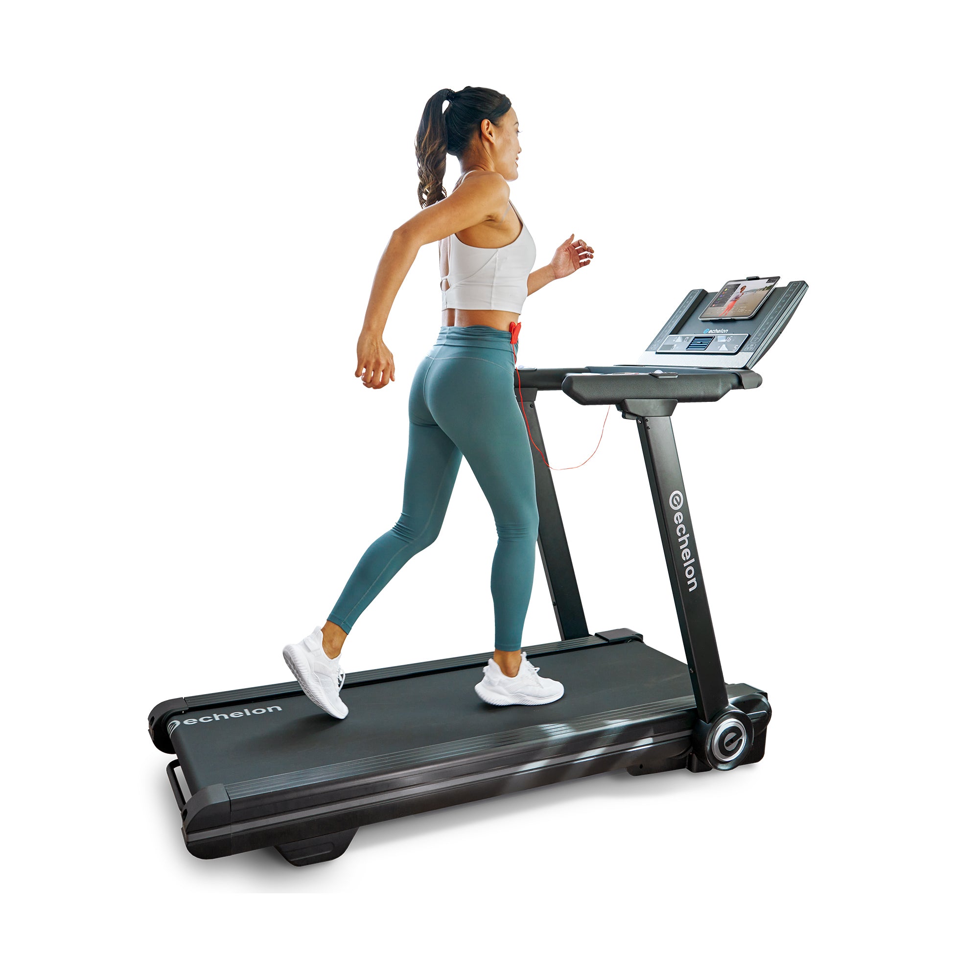 Woman jogging on a treadmill with a digital display.