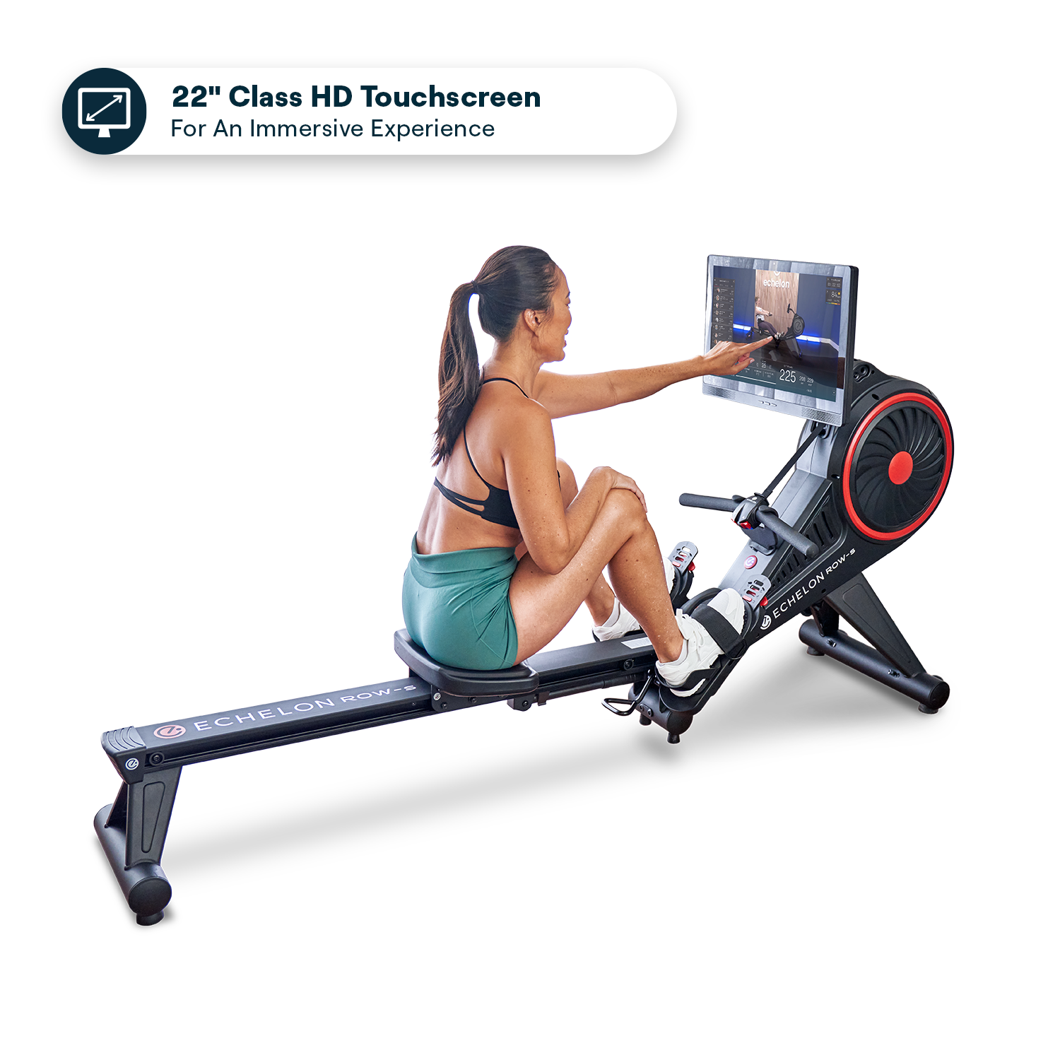 Woman using a rowing machine with a large touchscreen display.