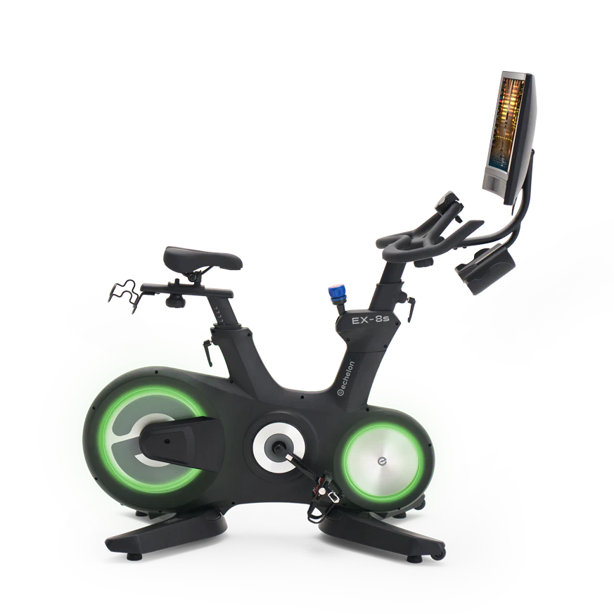 A stationary exercise bike with illuminated wheels and an attached digital screen.