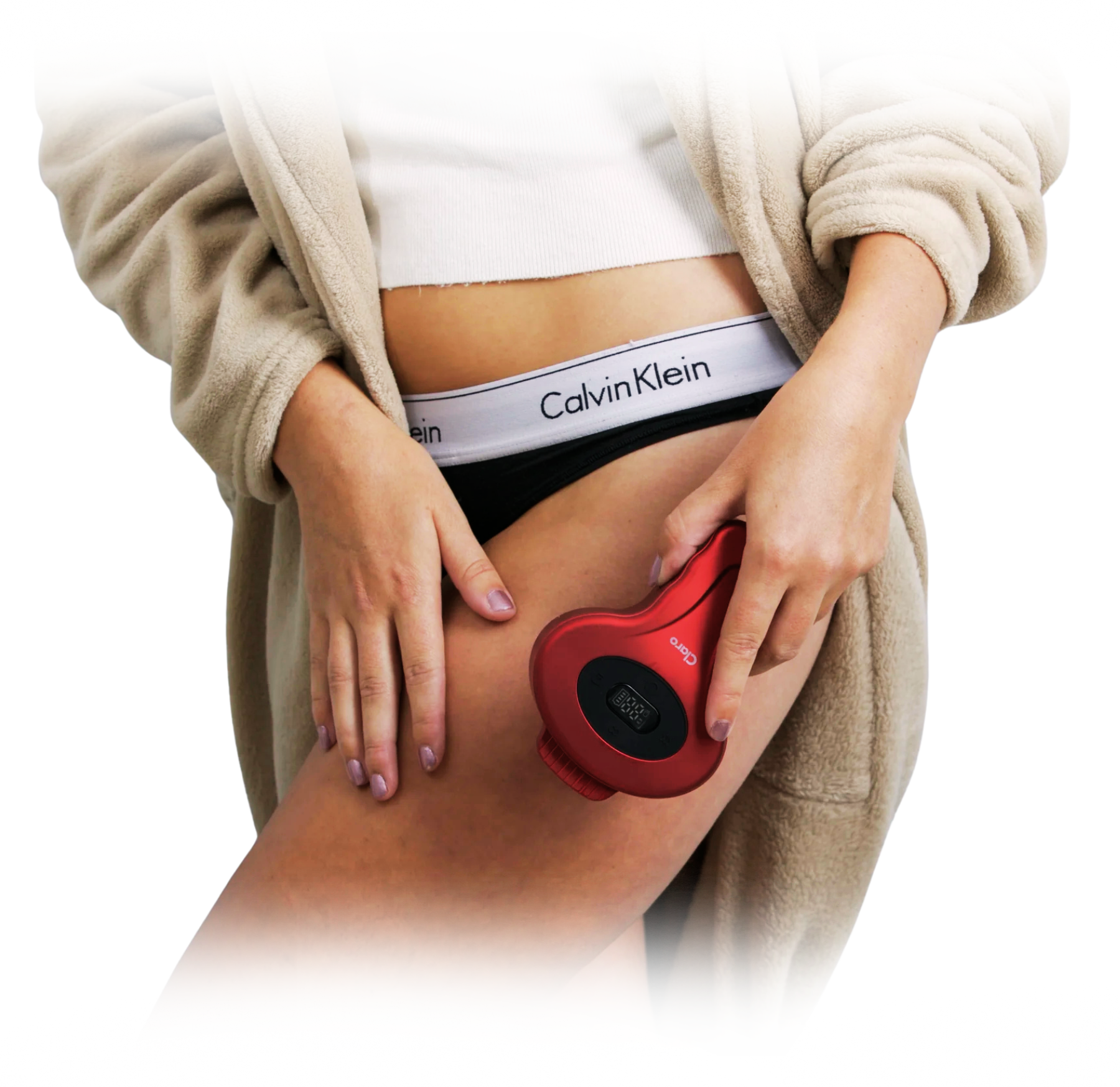Person using a red handheld device on their thigh.