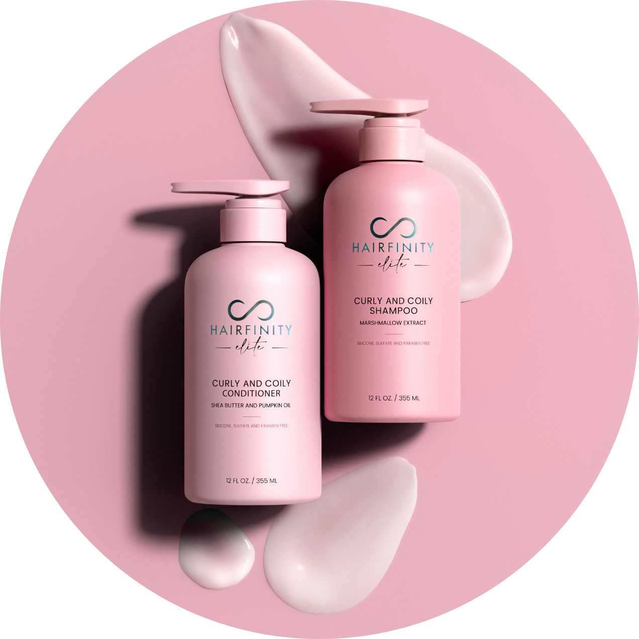 Two pink bottles of Hairfinity shampoo and conditioner on a pink background.