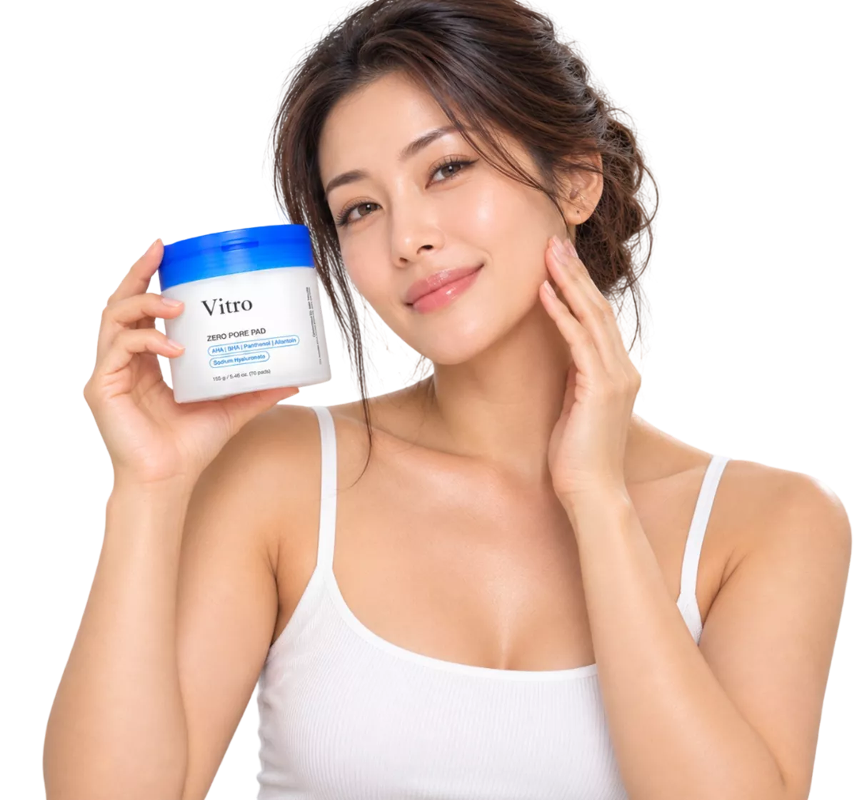 A woman in a white tank top holds a jar of Vitro Zero Pore Pads while touching her face.