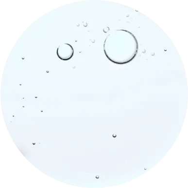 Clear liquid with bubbles on a white background.