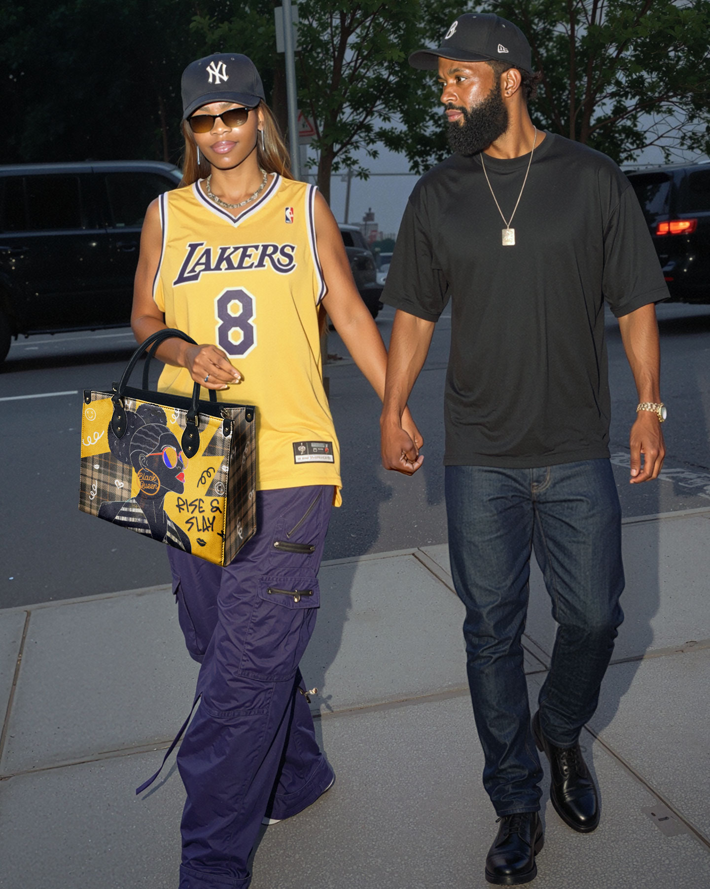 Two people walking, one wearing a Lakers jersey and carrying a patterned bag.