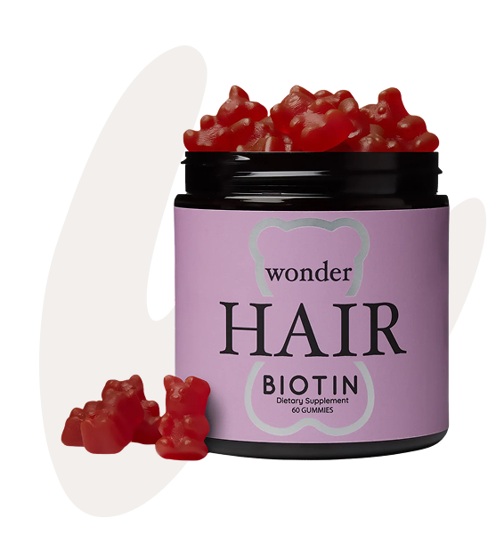 Jar of red gummy bears labeled 'Wonder Hair Biotin Dietary Supplement 60 Gummies.'