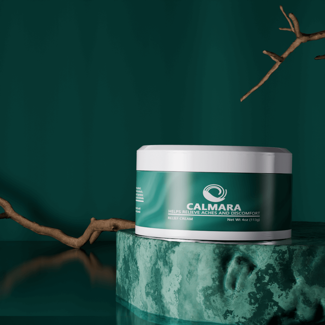 A jar of CalMara relief cream on a marble surface with branches.