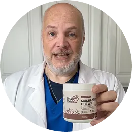 A man in a white lab coat holds up a jar of Petz Park Mushroom Chews.