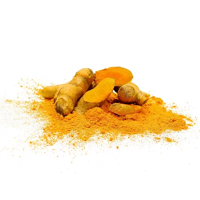 Fresh turmeric root and ground turmeric powder sit in a pile against a white background.