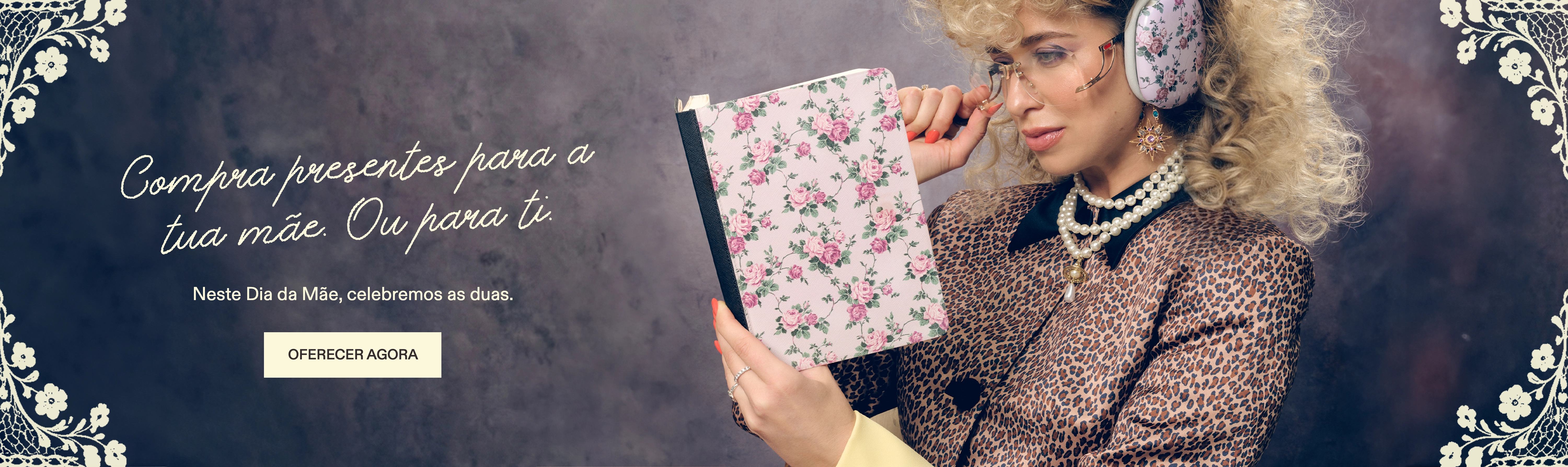 A woman in a leopard print jacket and headphones looks at a floral notebook.