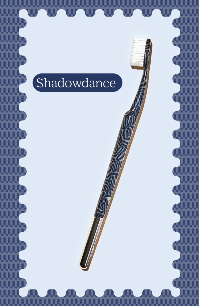 Toothbrush with geometric pattern on a decorative background.