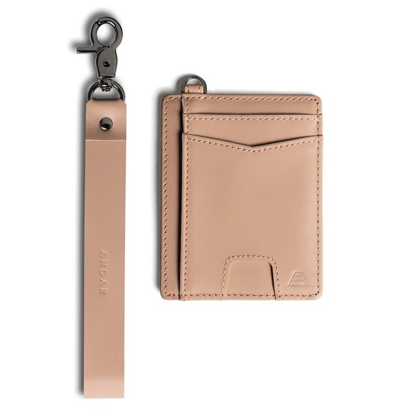 Tan leather cardholder with a matching detachable strap and metal clip.