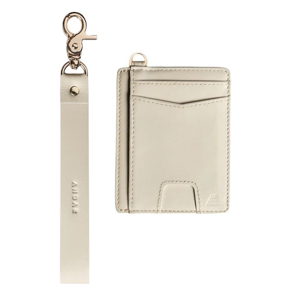 Beige cardholder with a matching strap and metal clasp.