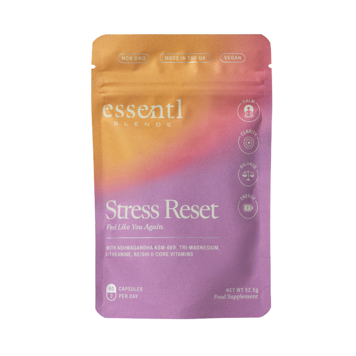 A purple and orange pouch of Essentl Blends Stress Reset food supplement against a dark green background.