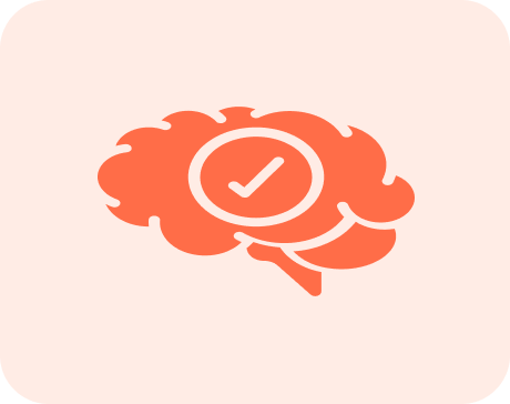 A coral-colored icon of a brain with a checkmark in a circle inside of it.