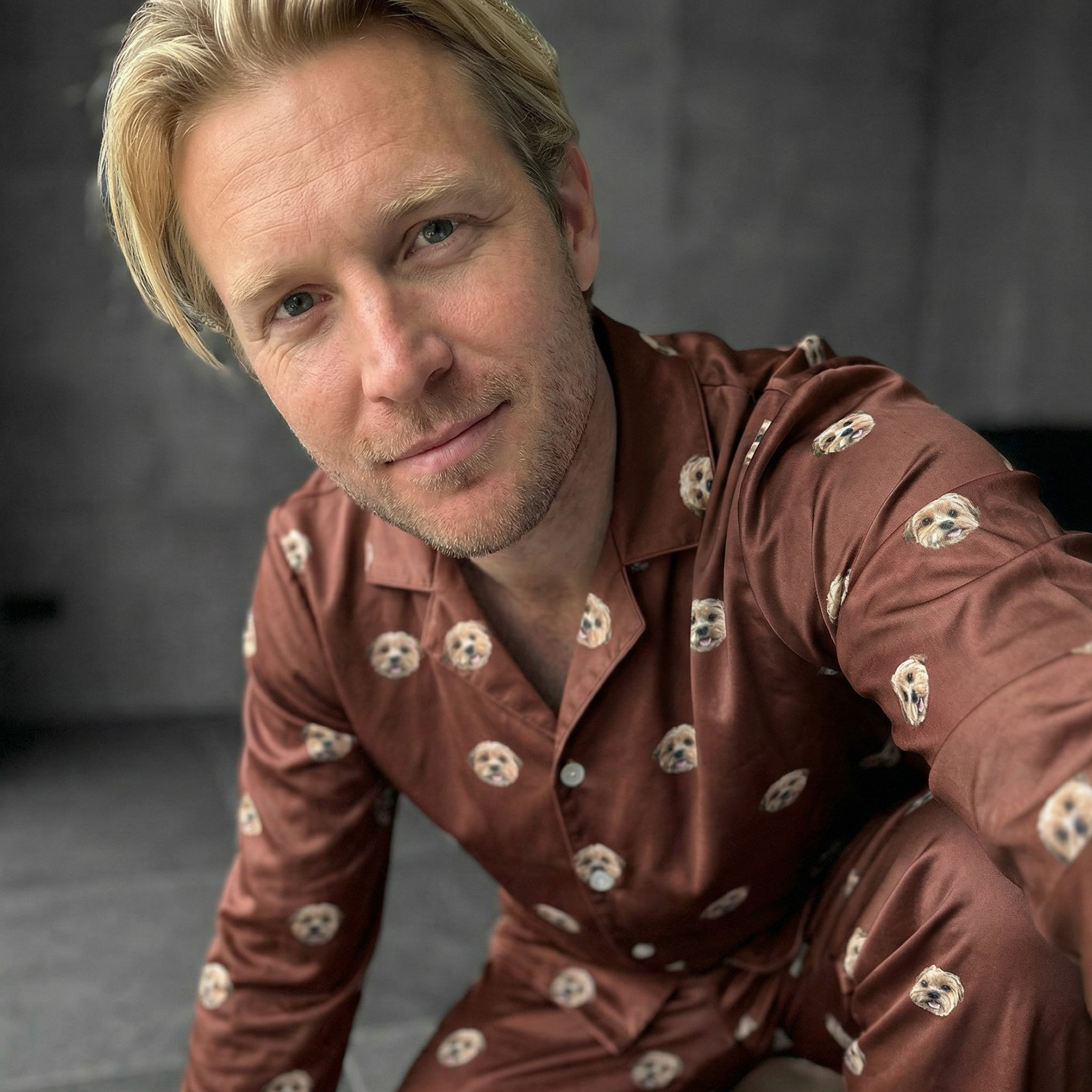 Sefie of a blond man with brown pajamas