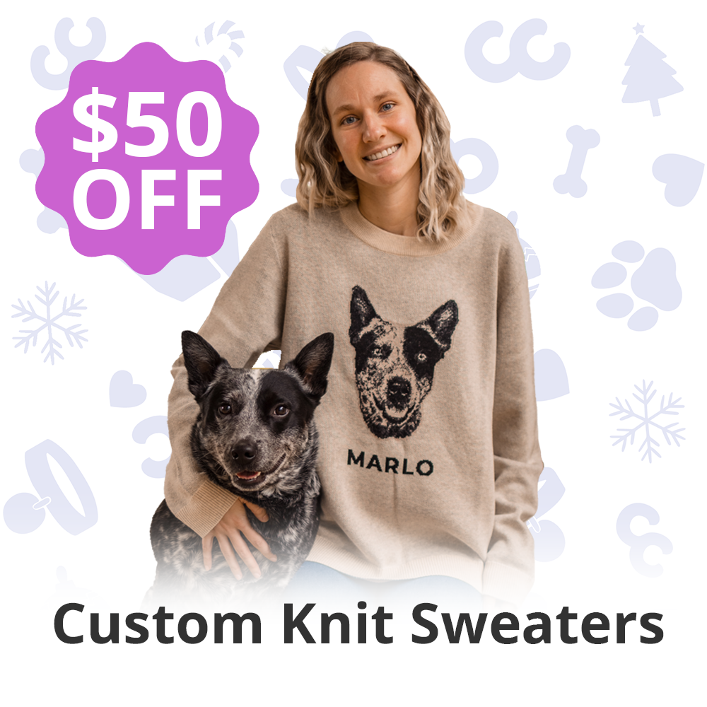 Smiling person with a dog, wearing a sweater with a dog design, $50 off text.