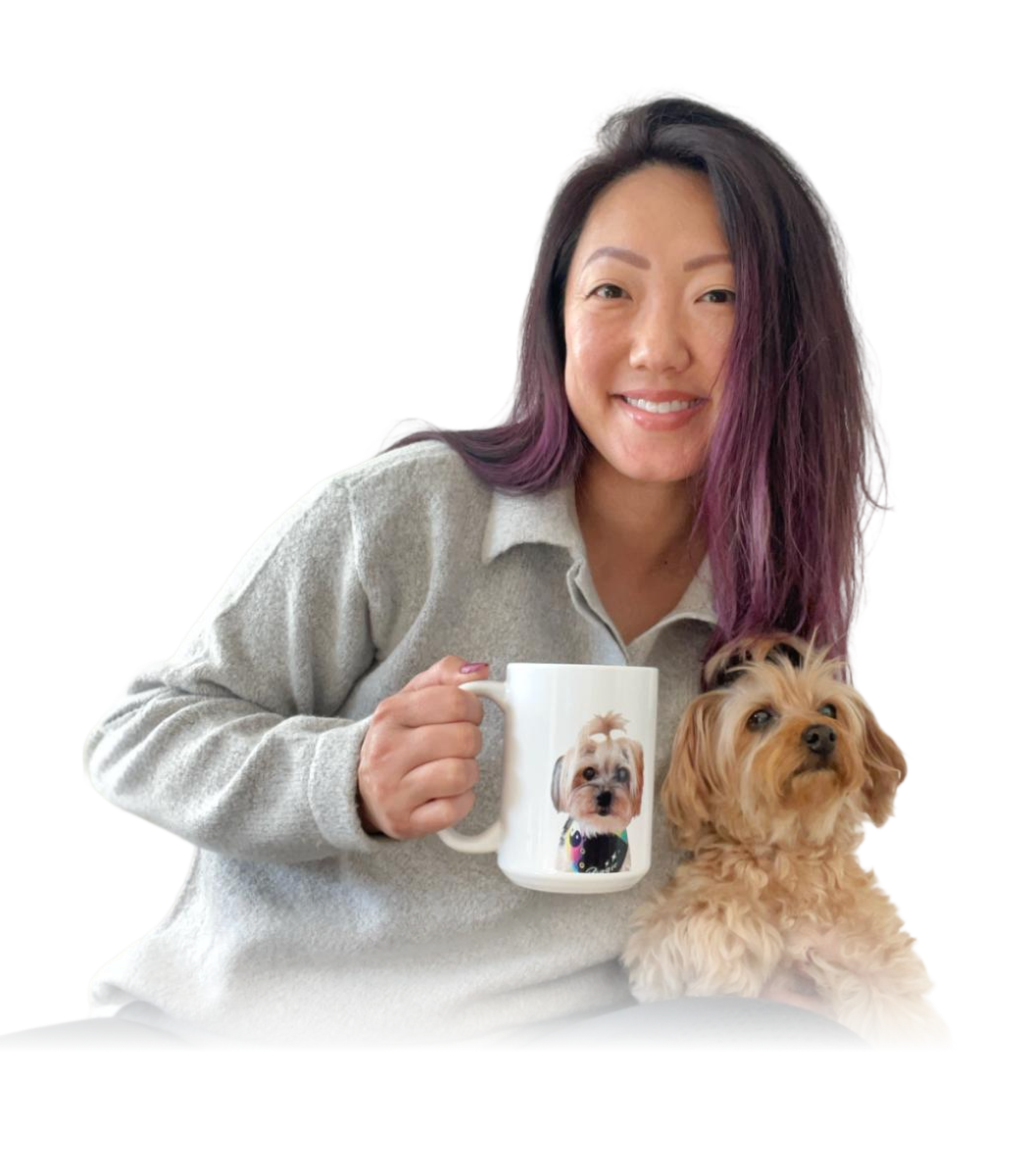 A smiling woman with dark hair and purple highlights is holding a white mug that features a portrait of a fluffy dog. 
