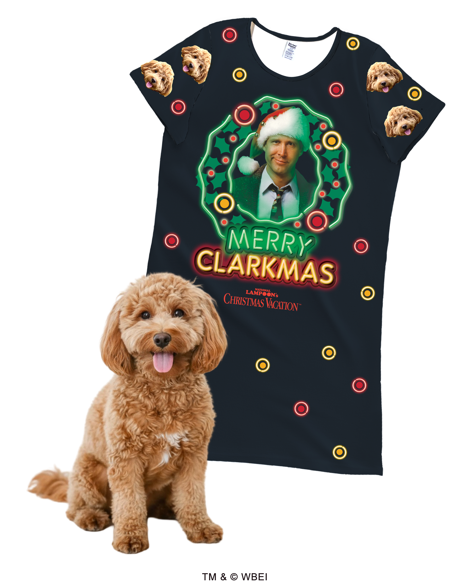 A black, short-sleeve nightgown featuring a large central graphic of Clark Griswold inside a light-up wreath with the text 'MERRY CLARKMAS.' The nightgown is patterned with small red and yellow circles (like ornaments). The sleeves are patterned with a repeating design of a fluffy brown Cockapoo's face. A real Cockapoo dog sits in the foreground.