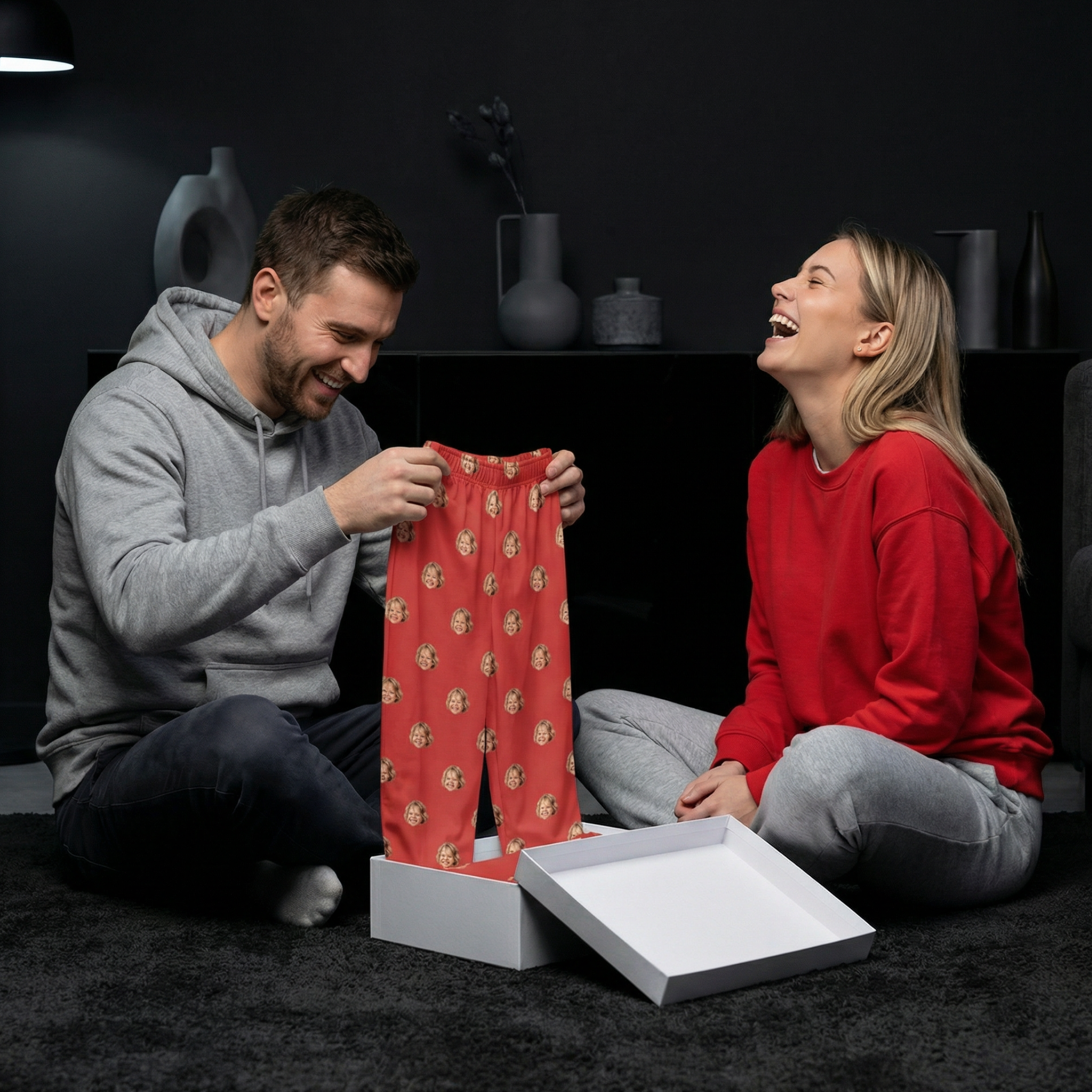 Couple laughing while exchanging gifts 
