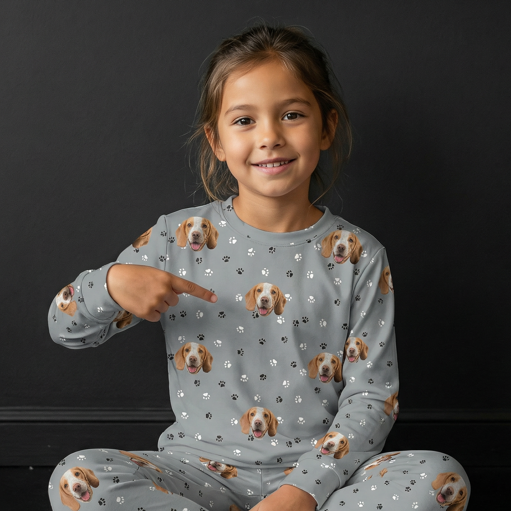 Girl wearing  a gray jogger pajamas.