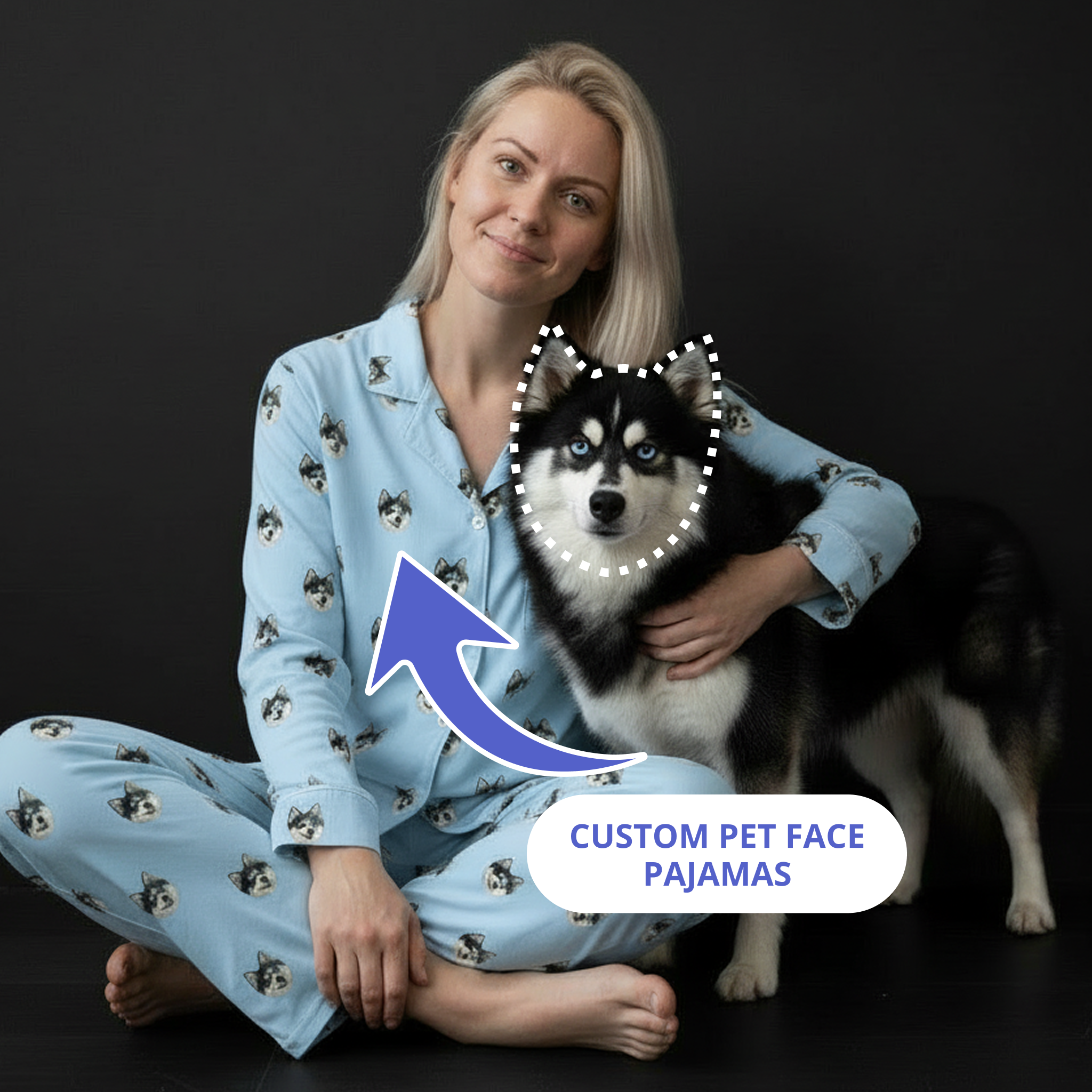 Woman in light blue dog-print button-down pajamas hugging a dog