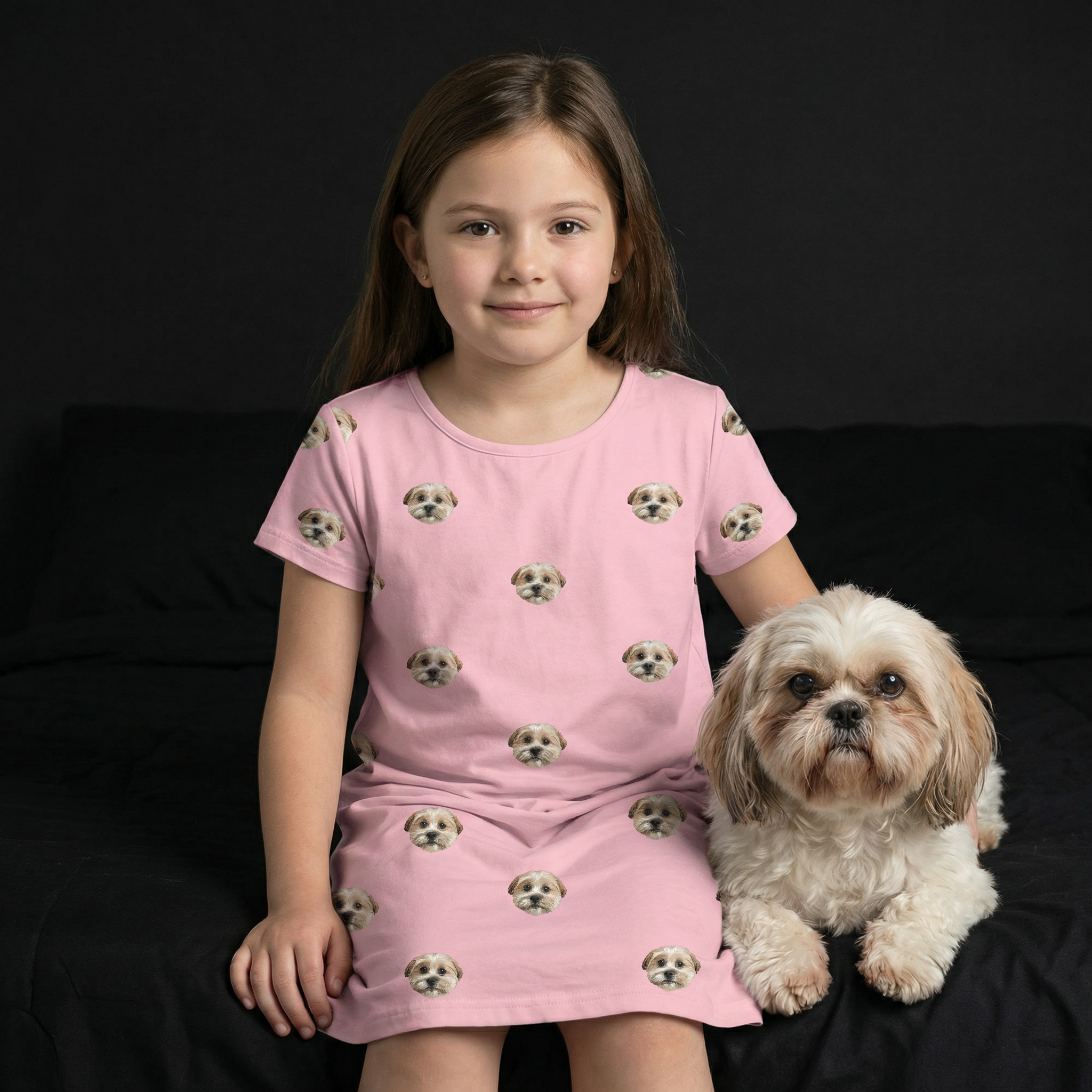 Brunette girl wearing a nightgown while she holds a dog.