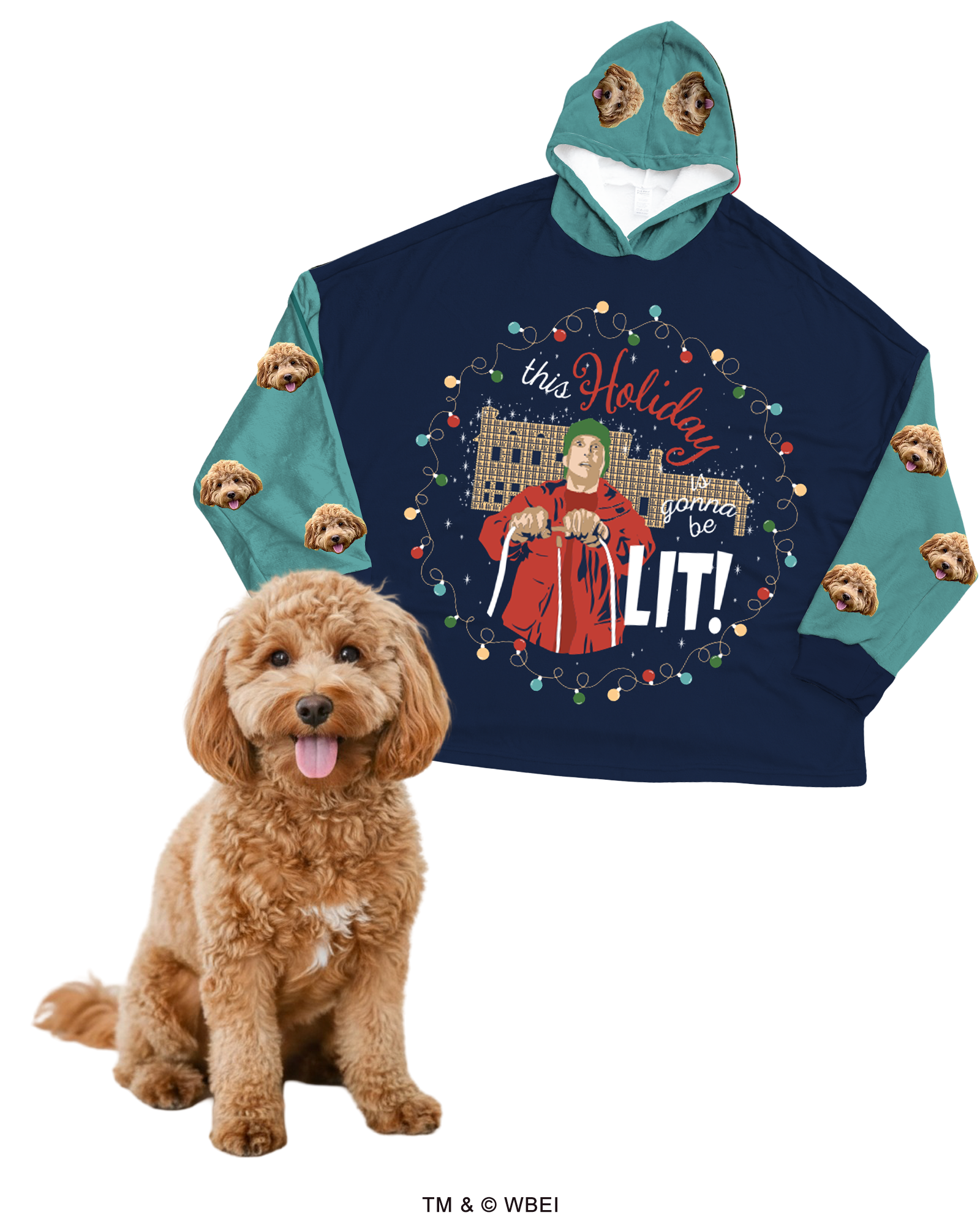 An oversized, navy blue hooded blanket featuring a large central graphic of Clark Griswold with Christmas lights and the quote 'this Holiday gonna be LIT!' The sleeves and hood are teal green, customized with a repeating design of a fluffy brown Cockapoo's face. A real Cockapoo dog sits in the foreground.