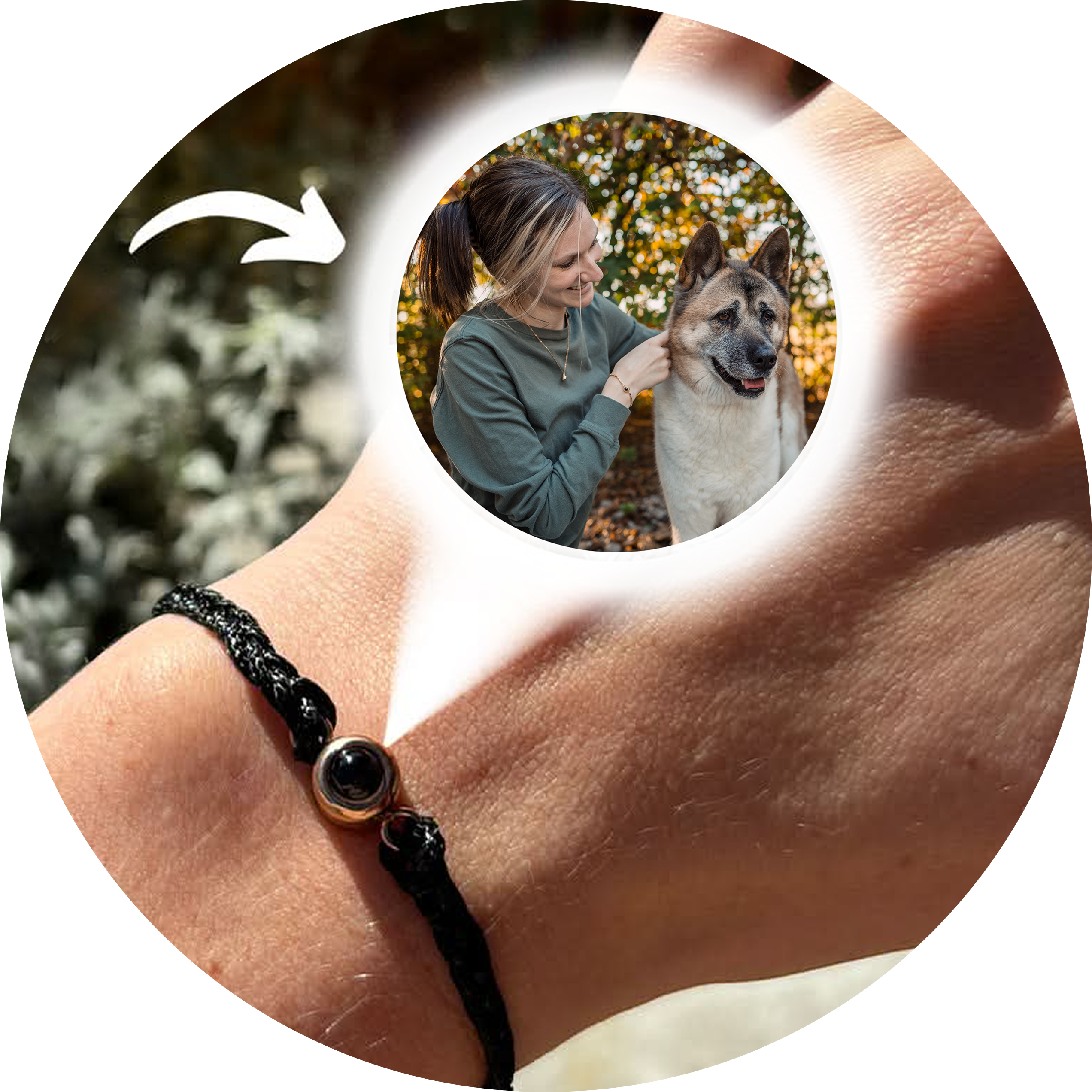 A close-up of a person's forearm shows them wearing a black woven bracelet with a small, circular black and gold charm. 