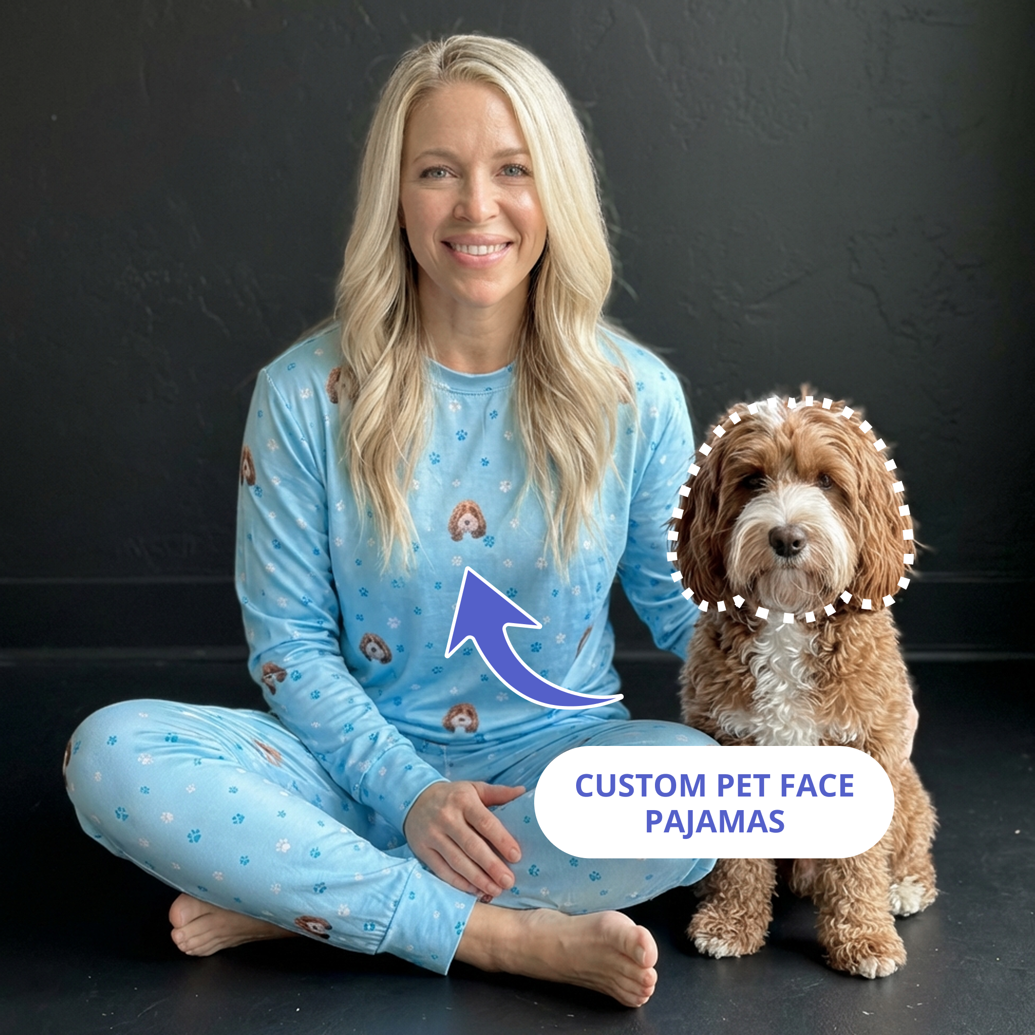 Blonde woman wearing light blue pajamas patterned with brown dog faces and paws.