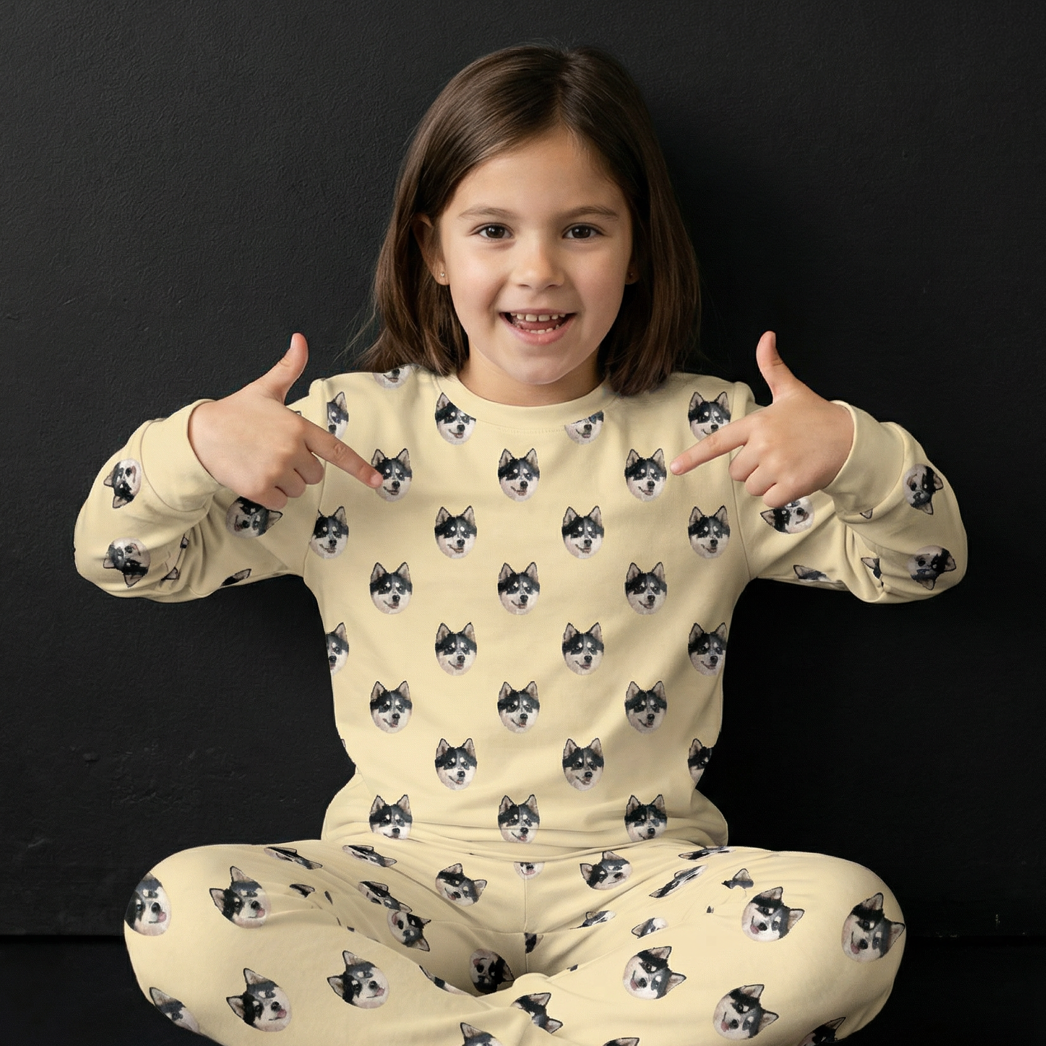 Kid showing her pajama.