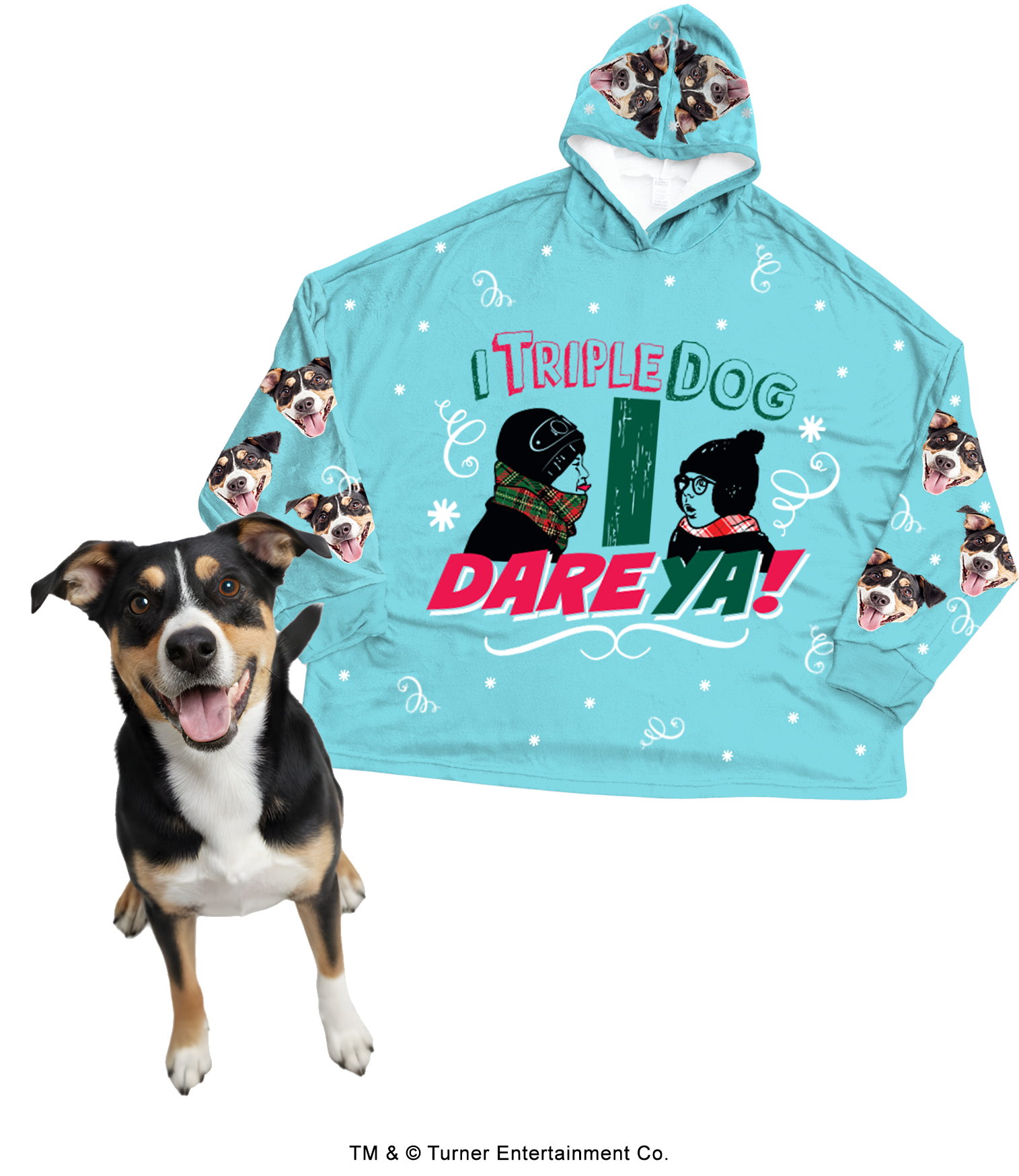 Promotional image for custom pet apparel. An oversized, light blue hooded blanket features a large graphic of Flick and Schwartz and the quote 'I TRIPLE DOG DARE YA!' The blanket is patterned with white snowflakes, scrollwork, and a repeating design of a fluffy brown Cockapoo's face on the sleeves and hood. A smartphone screen inset shows the original photo of the Cockapoo, with an arrow pointing to the blanket.
