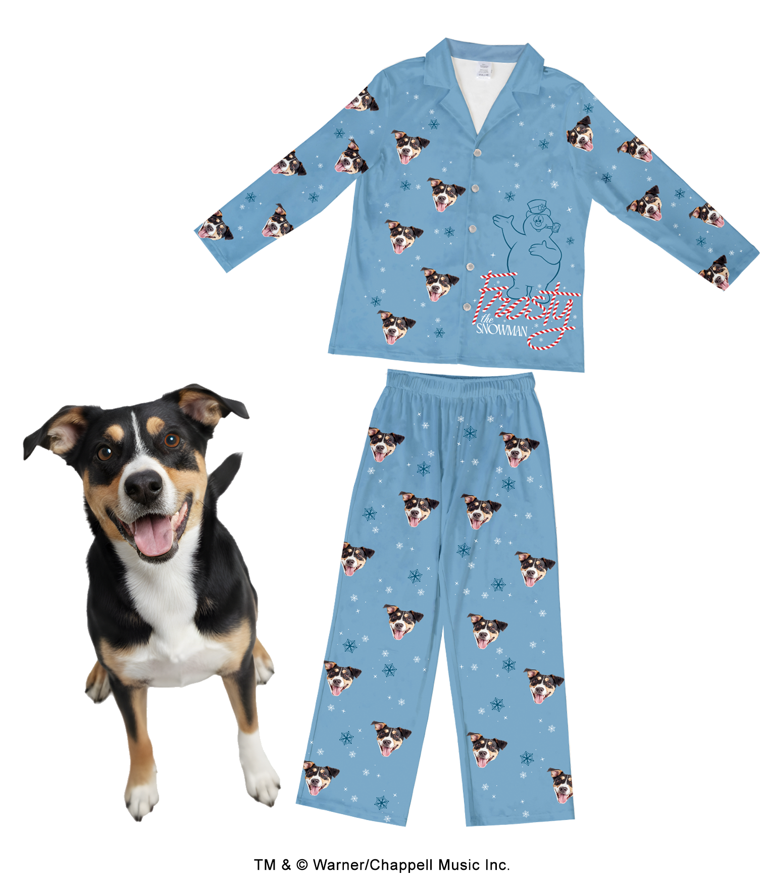 A light blue pajama set (long-sleeve top and pants) featuring a light blue outline graphic of Frosty the Snowman wrapped in red and white candy canes on the top, with the word 'Snowman' underneath. The pajamas are patterned with a repeating design of a black, white, and tan dog's face and snowflakes. A real dog with matching markings stands happily in the foreground.