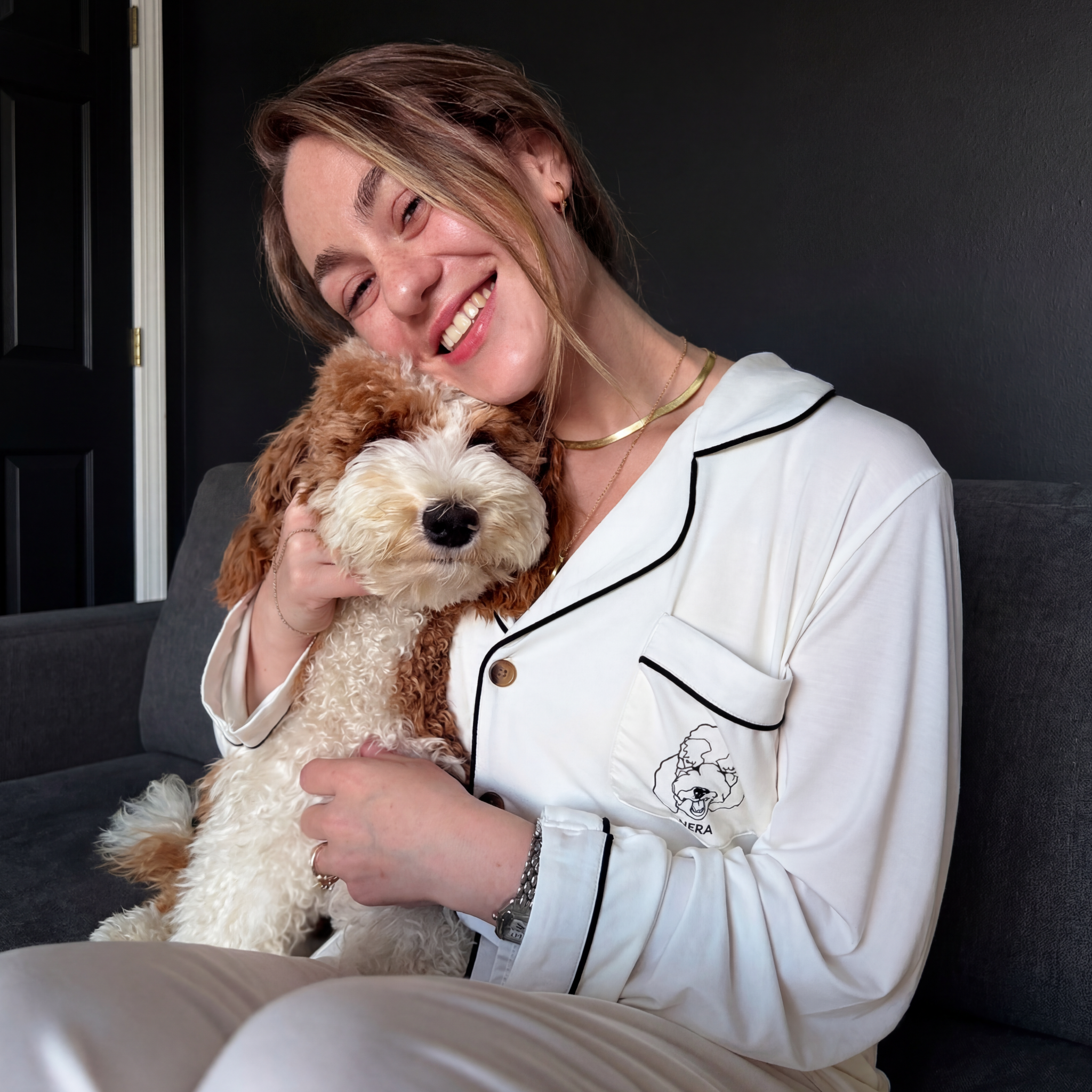 Woman & Goldendoodle, white PJs with custom 'SIERRA' 2-dog embroidery.