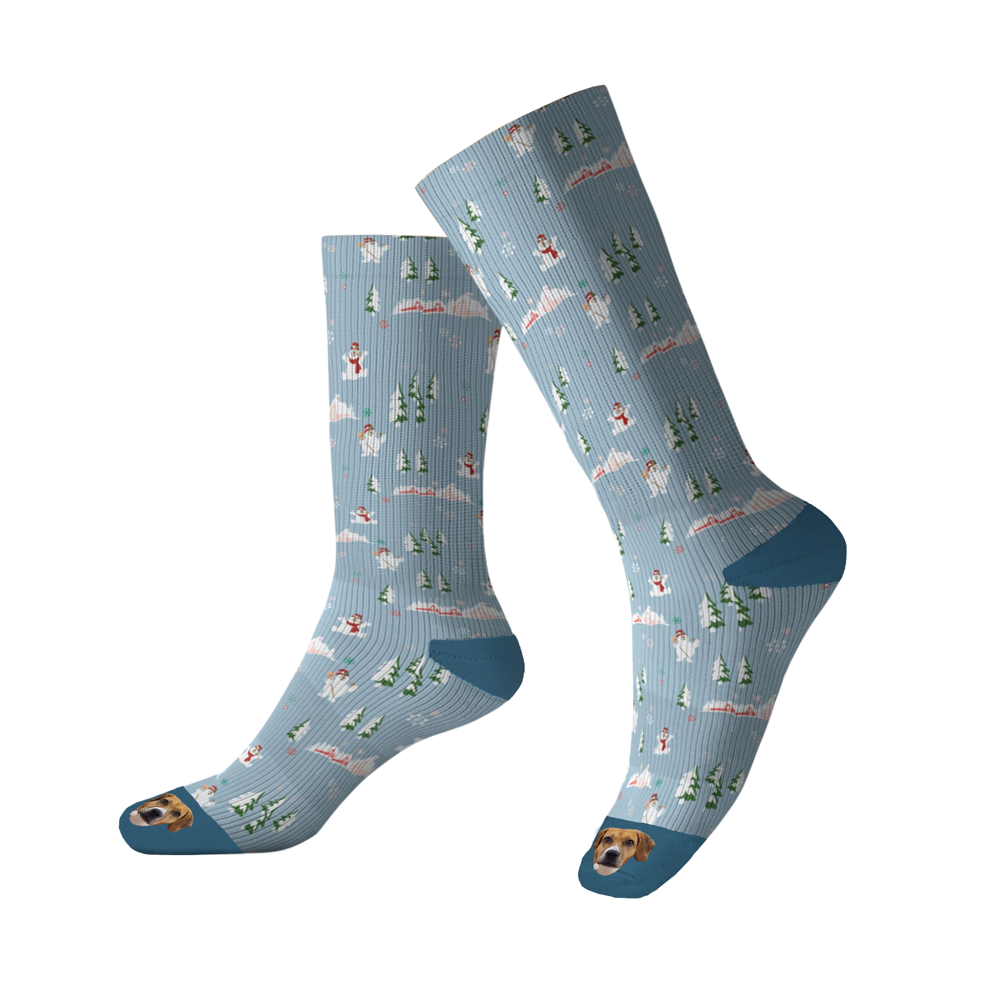 A pair of tall, light blue socks patterned with a repeating winter scene featuring snow-covered trees, clouds, and snowmen. The toe of each sock features an image of a brown and white dog's face.