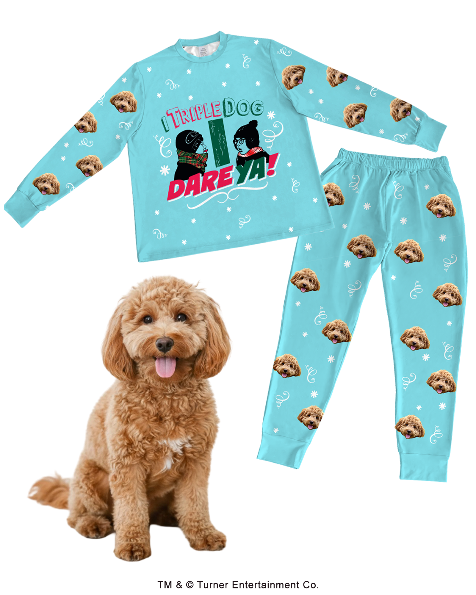 A light blue pajama set (long-sleeve top and pants) customized with a fluffy brown Cockapoo's face. The top features a graphic of Flick and Schwartz and the quote 'I TRIPLE DOG DARE YA!' The set is patterned with white snowflakes, scrollwork, and a repeating design of the Cockapoo's face. A real Cockapoo dog sits in the foreground.