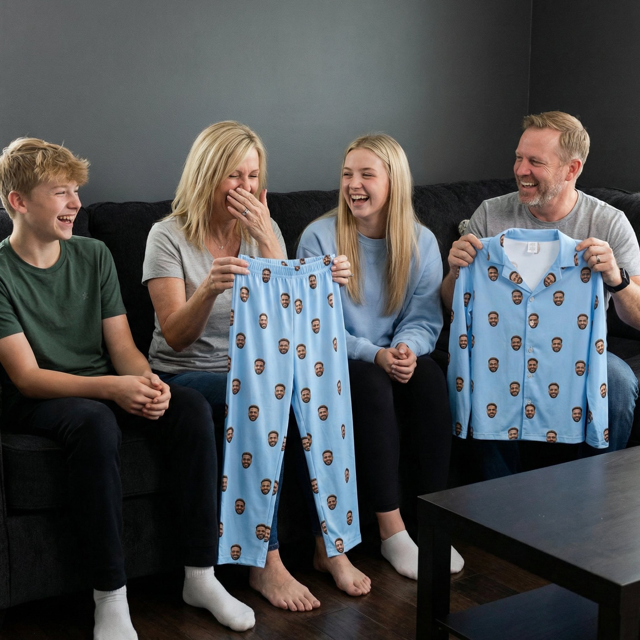 Four people laughing, holding custom photo pajama pants.